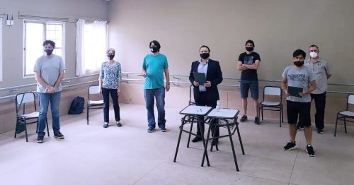 firma acuerdo con gremios